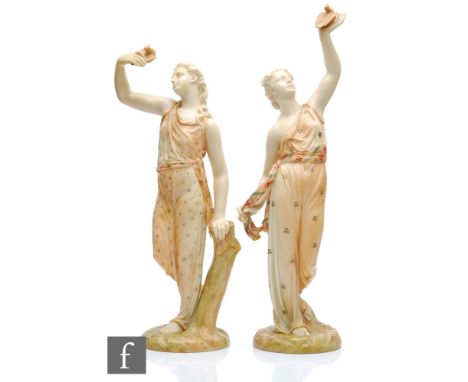 A pair of Royal Worcester James Hadley shape 116 figures representing Liberty and Captivity, modelled as classically dressed 