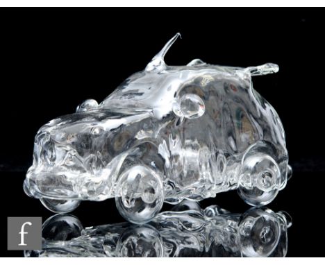 A clear glass lamp titled 'Boy Racer' by Ian Pearson Glass Creations, modelled as a car to hold a night light, length 23cm.NB
