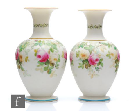 A pair of 19th Century Royal Worcester parian vases of globe and shaft form decorated with a band of roses to the body and fo