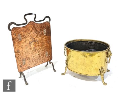 A 20th Century oval brass log basket, lion mask handles, on splayed paw feet, width 48cm, with shovel and an Art Nouveau copp