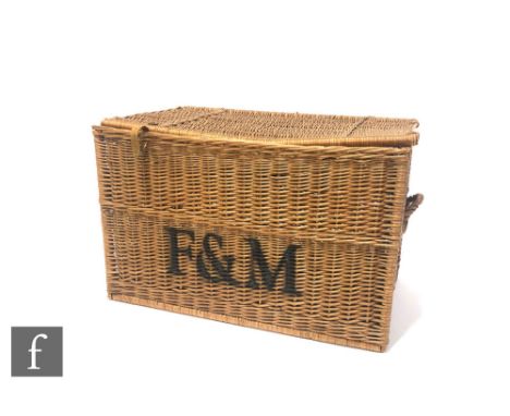 A large Fortnum &amp; Mason hamper basket, the rectangular form basket with leather straps to the front and printed F &amp; M