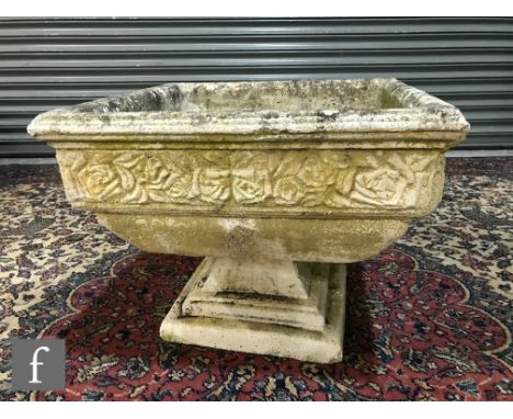 A 20th Century composite stone square planter, floral border, on stepped base, 53cm square. 