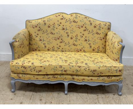 A French painted frame sofa, c.1900, upholstered in a charming yellow sprigged fabric (h.90cm x l.145cm x w.73cm)