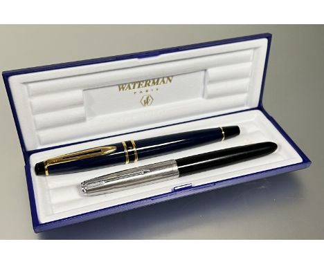 A black Parker (51?) pen with white metal/stainless steel cap, together with a blue Waterman pen and box