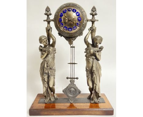 Blot a Prouard of Paris, a French mantle spelter clock modelled as two classical style figures supporting a zodiac globe, the
