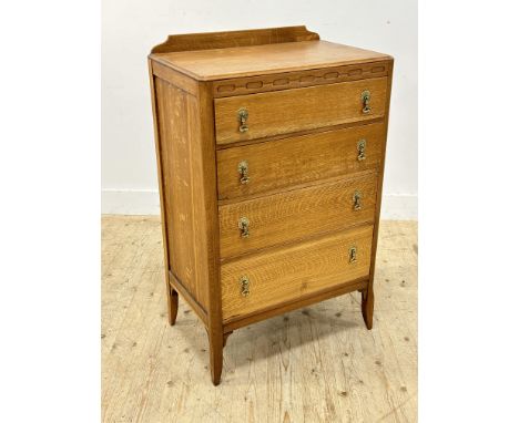 A 1930s light oak chest with original brass handles (h.107cm x l.66cm x w.42cm)
