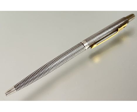 A sterling silver (cap and barrel) Parker ballpoint pen (75?) with gold plated/yellow metal arrow-form clip