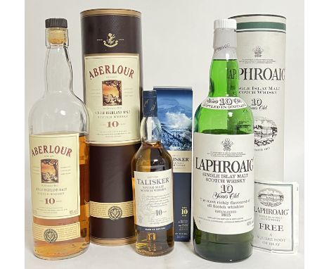 A mixed group of whisky comprising a boxed Talisker Single Malt Scotch Whisky (200ml, unopened), Laphroaig Single Islay Malt 