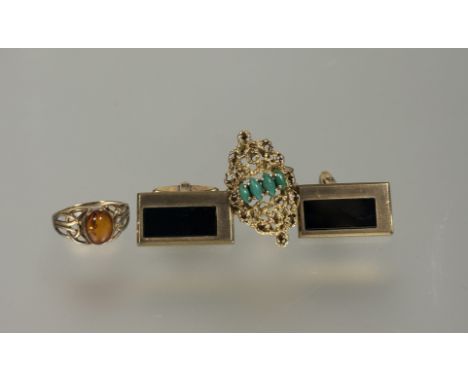 A 9ct gold ring set amber cabouchon N 1.52g, a gilt metal dress ring set four green stones N 5.3g and a pair of 8ct metal sll