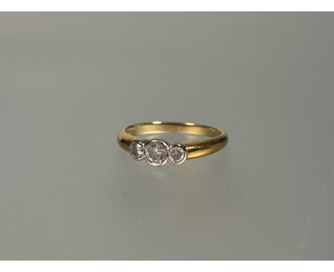 A 18ct gold three stone graduated round brilliant cut diamond ring center stone approxiamately .33ct P 3.96g&nbsp;