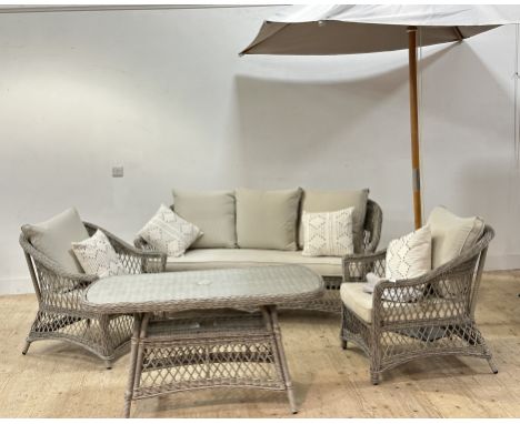 A very stylish woven all weather plastic rattan effect four piece garden set with large adjustable garden parasol, the rattan