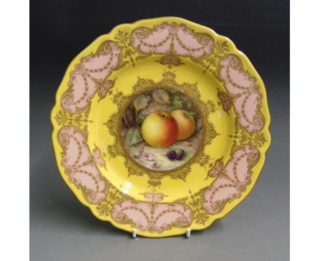 A Royal Worcester cabinet plate, deep yellow ground with a border of pink and gilt, the centre painted with fruit berries and