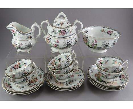 A mid-nineteenth century black and white transfer-printed part tea service, c. 1840-60. It is decorated with a chinoiserie sc