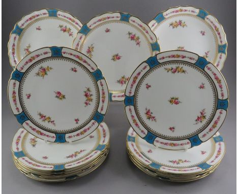 A set of early twentieth century Copeland plates and shallow dishes, c. 1904. Each are decorated with flowers, glided bands a