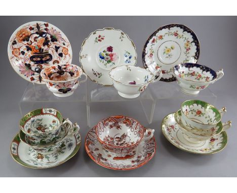 A group of early nineteenth century British porcelain hand-painted and some transfer-printed cups and saucers, c.1820-40. To 