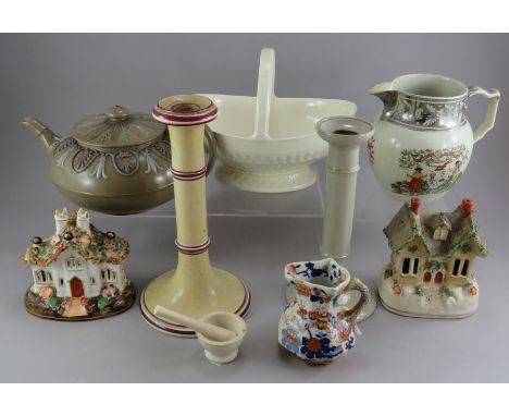 A group of early and mid-nineteenth century pottery, c.1825 - 1880. To include a Farmers Arms jug with silver lustre rim, a W