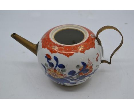 An eighteenth century Chinese porcelain Imari bullet-shaped teapot with tinker-type brass spout and handle.&nbsp;