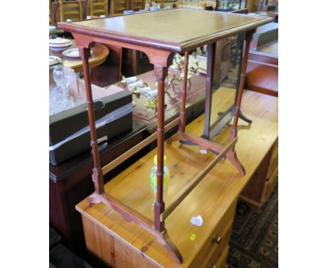 A mahogany toilet mirror, with swing plate on downswept legs and brass ball feet and a boxwood lined occasional table