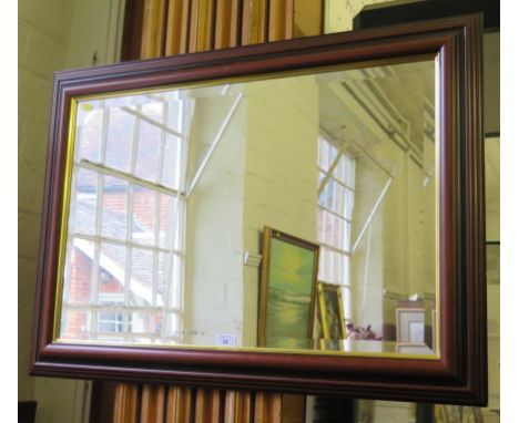 A modern mahogany framed rectangular wall mirror, with bevelled plate, gilt slip and moulded frame, 65cm x 90cm