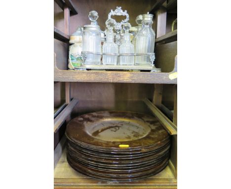 A silver plated condiment stand with eight bottles, three German steins, a water jug, a Halma camera and fourteen amber glass