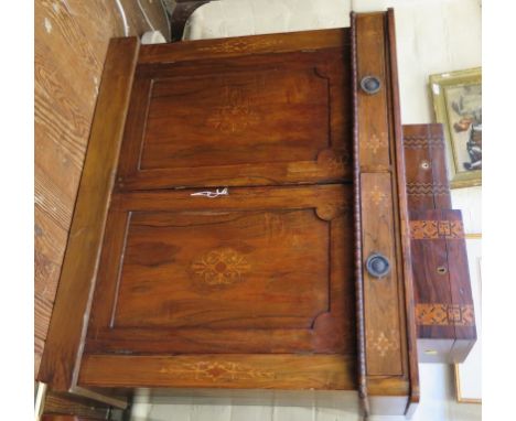 A mid Victorian rosewood and inlaid chiffonier, with two frieze drawers above a beaded edge and two panel doors on a plinth b