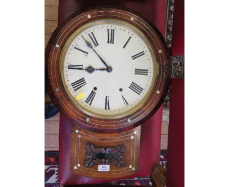 A mid Victorian rosewood and mother of pearl inlaid wall clock, with scroll carved glazed panel, the twin train striking on a