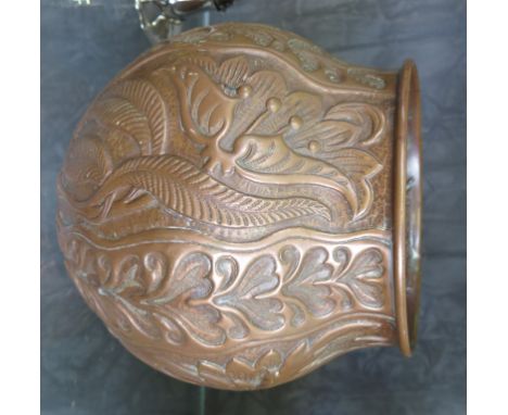 An Arts & Crafts copper planter by John Pearson, of bulbous form with repousse floral and foliate decoration, signed and date