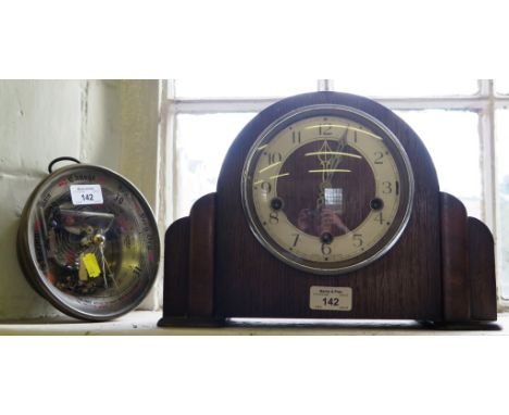 An oak mantel clock, with silvered chapter ring, and a barometer mechanism (2)