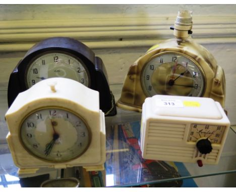 An Ivanlet vintage plastic transistor radio, a Metamec vintage plastic mantel clock, three other vintage plastic mantel clock