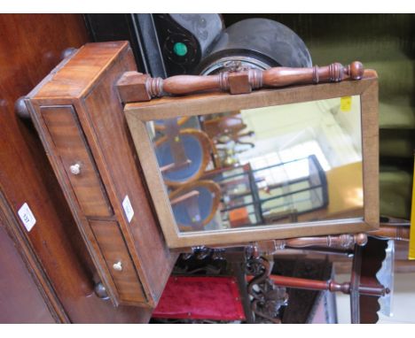 A William IV mahogany toilet mirror, the rectangular plate within baluster supports over a pair of ebony lined drawers on bal