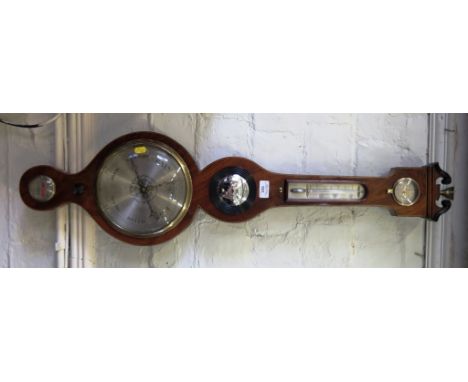 An early 19th century mahogany barometer, with ebony and boxwood stringing, with scrolling broken pediment over a hygrometer,