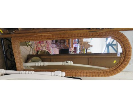 A wicker and iron cheval mirror, with arched plate and scrolled supports, 155cm