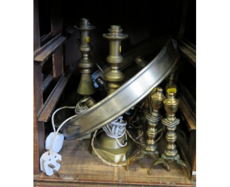A pair of brass firedogs, with finials and square section reeded supports, various brass fire irons, a pair of brass candlest