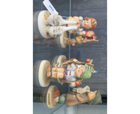 Four Hummel children figures and another (5)