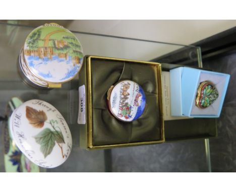 Two enamel pill boxes cased by Halcyon Days and Crummies & Co. together with two other porcelain pill boxes 