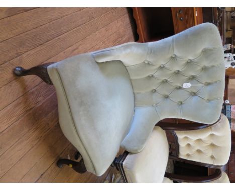 A button upholstered nursing chair with acanthus carved cabriole legs