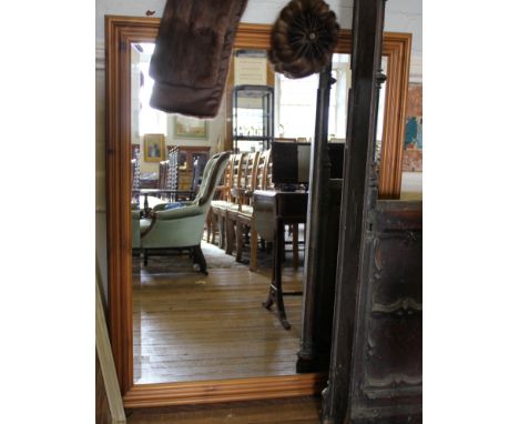 A rectangular wall mirror, with bevelled plate and moulded pine frame, 134cm x 104cm