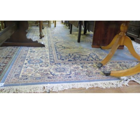 A 'Royal Keshan' blue ground carpet, with ivory medallion and scroll spandrels within an ivory floral border, 376cm x 275cm