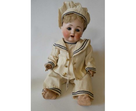 A Max Handwerck Bebe Elite bisque socket head sailor doll with blue glass sleeping eyes, open mouth, applied teeth, compositi