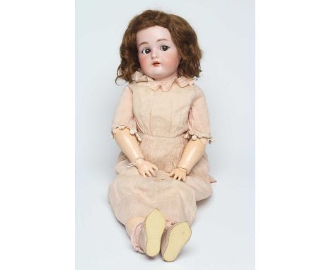 A Simon &amp; Halbig Kammer &amp; Reinhardt bisque socket head doll with brown glass sideways glancing flirty eyes, metal sle