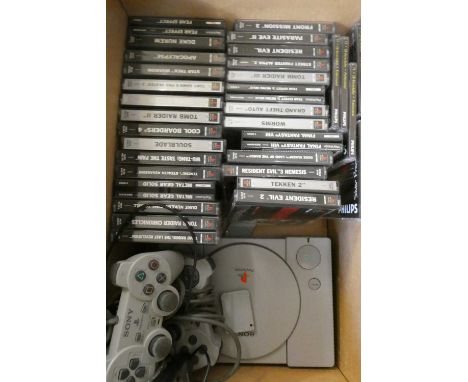 Playstation with controllers and 28 boxed games, including Tomb Raider, Tomb Raider II and III, Tony Hawk's Pro Skater 2, Met