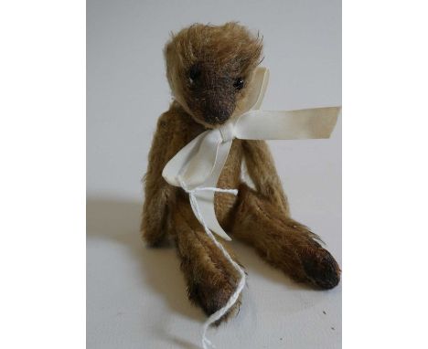 Soldier bear, with one button eye and one sewn, light orange plush, jointed neck, shoulders and hips, 6" long (Est. plus 24% 