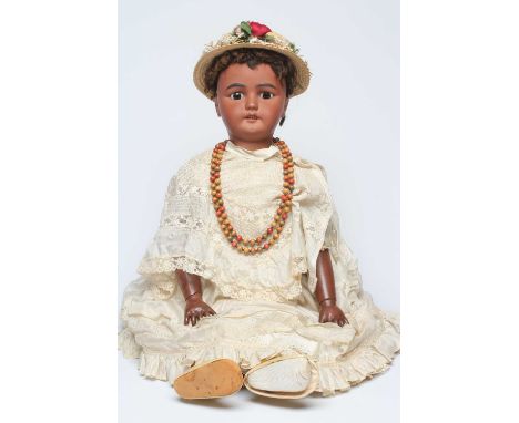 A large Simon &amp; Halbig bisque socket head doll, with brown glass sleeping eyes, open mouth, applied teeth, pierced ears, 