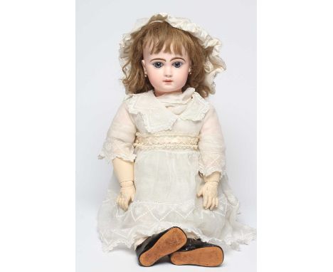 A Bebe Jumeau bisque socket head doll, 1890, with blue glass paperweight fixed eyes, closed mouth, pierced ears, light brown 