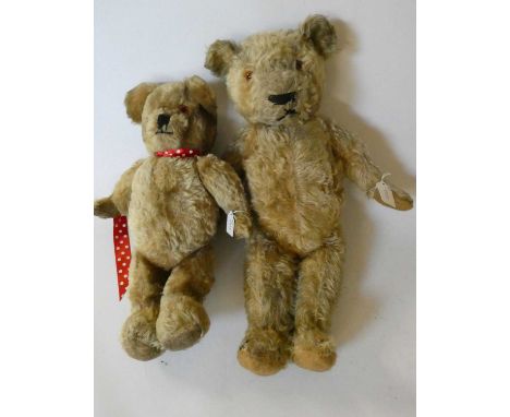 Two vintage English teddy bears, comprising a 22 1/2" orange plush growling bear with amber eyes, sewn nose and felt pads, an