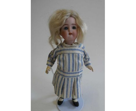 A Kammer &amp; Reinhardt Halbig bisque socket head doll, with blue glass sleeping eyes, open mouth, teeth, blond wig, jointed