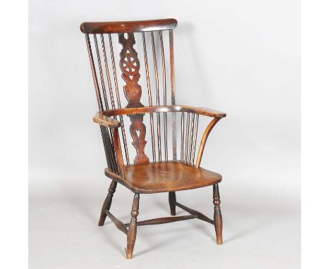 A mid-19th century ash and elm stick and wheel back Windsor armchair with flattened handrests, height 105cm, width 63cm, dept