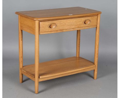 A modern Ercol pale elm side table, hight 72cm, width 80cm, depth 41cm.