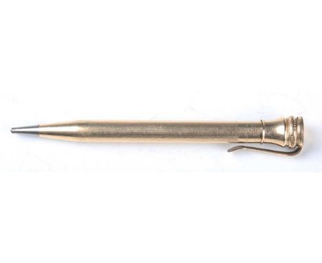 A 9ct gold propelling pencil with engine turned surface, detailed 'The Mascot', length 12cm, together with six other propelli
