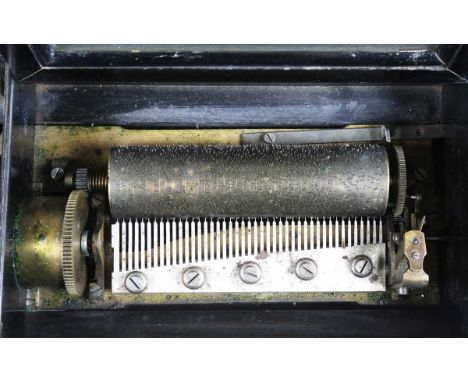 A late 19th century Swiss music box, the lever-wind mechanism playing eight airs on a 15.3cm cylinder, the tune sheet and mec